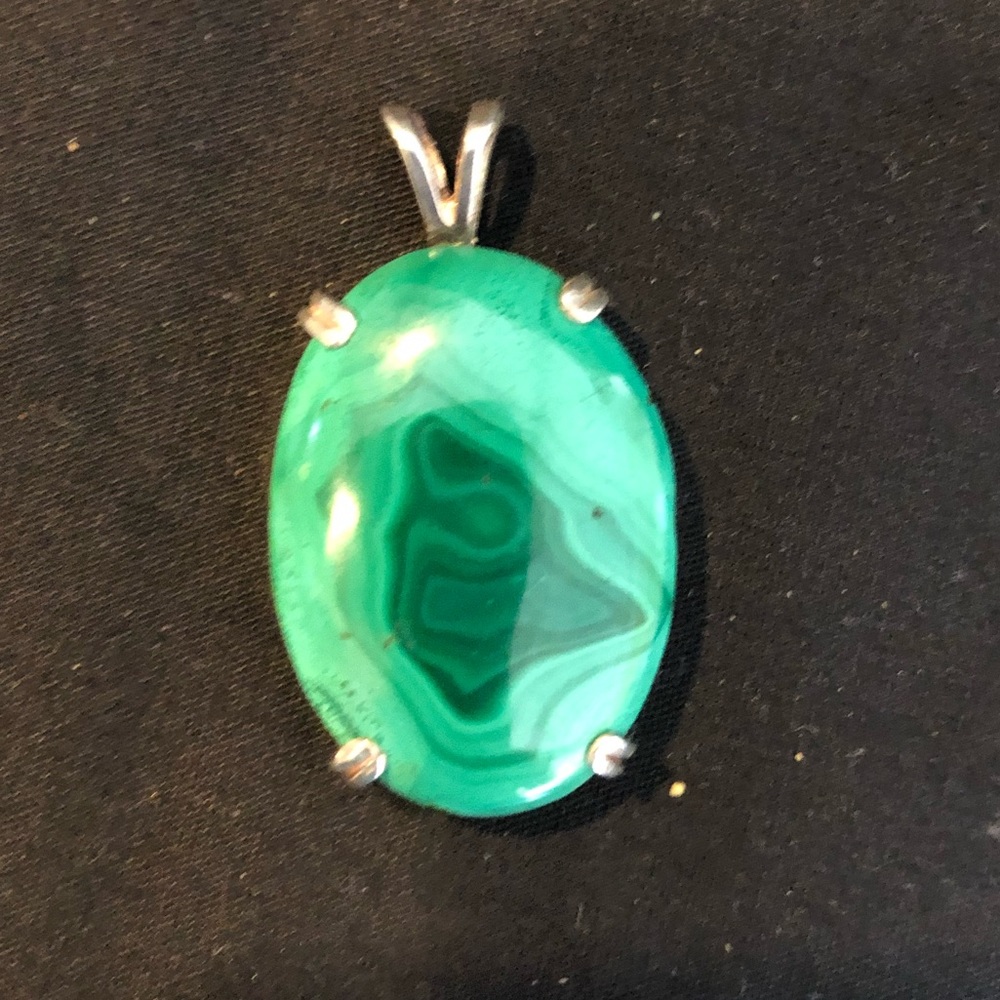 Green pendant on gold color